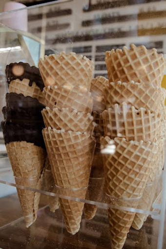 A Mouthwatering Treat of Ice Cream in a Fresh Waffle Cone from Rosie's.