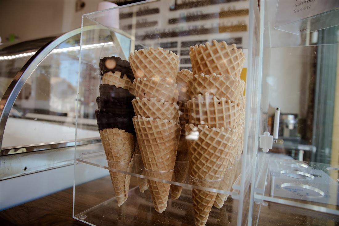 A case of freshly pressed waffle cones, some dipped in chocolate, at Rosie's Ice Cream